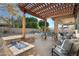 Wonderful covered patio area with a fire pit and backyard swimming pool at 3115 E Turnberry Dr, Gilbert, AZ 85298