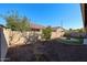 Landscaped backyard with gravel, trees, and a fire pit at 3134 E Sunrise Pl, Chandler, AZ 85286