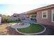 Charming backyard with fire pit and artificial turf at 3134 E Sunrise Pl, Chandler, AZ 85286