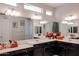 Elegant bathroom with double vanity, large mirror, and modern lighting at 3134 E Sunrise Pl, Chandler, AZ 85286