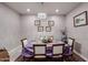 Formal dining room with a table set for six and hardwood floors at 3134 E Sunrise Pl, Chandler, AZ 85286