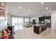 Open floor plan with a kitchen island and stainless steel appliances at 3134 E Sunrise Pl, Chandler, AZ 85286