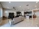 Open concept living room and kitchen with tile floors and modern kitchen cabinets at 3134 E Sunrise Pl, Chandler, AZ 85286