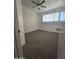 Well-lit bedroom with ceiling fan and neutral carpeting at 3307 W Altadena Ave, Phoenix, AZ 85029