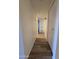 Clean hallway with light walls and wood-look floors at 3307 W Altadena Ave, Phoenix, AZ 85029