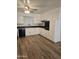 Clean kitchen featuring white cabinets, wood-look floors, and a ceiling fan at 3307 W Altadena Ave, Phoenix, AZ 85029