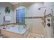 Bathroom features a large shower and a built-in glass block window at 33448 N 69Th Pl, Scottsdale, AZ 85266