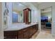 Double vanity bathroom with granite countertops and a large mirror at 33448 N 69Th Pl, Scottsdale, AZ 85266