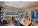 Elegant dining room featuring a fireplace and large windows at 33448 N 69Th Pl, Scottsdale, AZ 85266