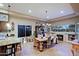 Bright dining room with large windows and a wooden table at 33448 N 69Th Pl, Scottsdale, AZ 85266