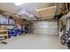 Garage with overhead storage, workbench, and bicycles at 33448 N 69Th Pl, Scottsdale, AZ 85266