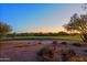 Scenic sunset view of a lush golf course at 33448 N 69Th Pl, Scottsdale, AZ 85266