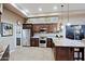 Spacious kitchen with granite counters and dark wood cabinets at 33448 N 69Th Pl, Scottsdale, AZ 85266