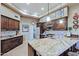 Granite kitchen island with stainless steel appliances at 33448 N 69Th Pl, Scottsdale, AZ 85266