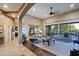 Bright and airy living room with hardwood floors, fireplace, and access to the backyard at 33448 N 69Th Pl, Scottsdale, AZ 85266