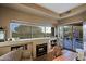 Cozy living room with fireplace and built-in shelving at 33448 N 69Th Pl, Scottsdale, AZ 85266