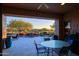 Covered patio with seating area and stunning views of the golf course at 33448 N 69Th Pl, Scottsdale, AZ 85266