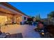 Evening view of patio area with seating and lighting at 33448 N 69Th Pl, Scottsdale, AZ 85266