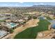 A beautiful aerial view of the community including the golf course and clubhouse at 3374 E Virgil Dr, Gilbert, AZ 85298