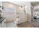 Modern bathroom featuring a step-in shower with dual shower heads and glass block window at 3374 E Virgil Dr, Gilbert, AZ 85298