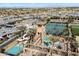 Aerial view of the community pool area, featuring a slide, pool and tennis courts at 3374 E Virgil Dr, Gilbert, AZ 85298