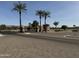 Gated community entrance with palm trees and brick pavers at 3374 E Virgil Dr, Gilbert, AZ 85298