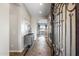 Inviting foyer featuring tile flooring, a decorative console table, and an ornate metal security door at 3374 E Virgil Dr, Gilbert, AZ 85298