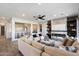 Spacious living area featuring neutral tones, a modern fireplace, and an open layout with great natural lighting at 3374 E Virgil Dr, Gilbert, AZ 85298