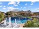 Inviting pool featuring decorative fountains, mature landscaping, and an outdoor seating area at 3374 E Virgil Dr, Gilbert, AZ 85298