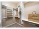 Spacious walk-in closet featuring custom white shelving and ample storage space at 3374 E Virgil Dr, Gilbert, AZ 85298