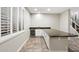 Stylish wet bar featuring white cabinets and dark countertops at 3374 E Virgil Dr, Gilbert, AZ 85298