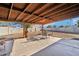 Covered patio with seating area, overlooking a grassy backyard at 3410 E Everett Dr, Phoenix, AZ 85032