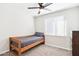 Simple bedroom with a twin-size bed, dresser, and ceiling fan at 3410 E Everett Dr, Phoenix, AZ 85032