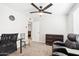 Cozy bedroom featuring a desk, chair, dresser, and ceiling fan at 3410 E Everett Dr, Phoenix, AZ 85032