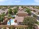 Property view showcasing the house, pool, and neighborhood at 3471 E Powell Way, Gilbert, AZ 85298