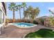 Desert landscape with a pool and palm trees at 3471 E Powell Way, Gilbert, AZ 85298