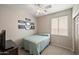 Bedroom with a ceiling fan and ample natural light at 3471 E Powell Way, Gilbert, AZ 85298