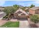 Single-story home with a two-car garage and landscaped front yard at 3471 E Powell Way, Gilbert, AZ 85298