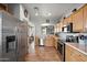 Bright kitchen featuring stainless steel appliances and wood cabinets at 3471 E Powell Way, Gilbert, AZ 85298