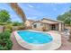 Relaxing kidney-shaped pool and patio area at 3471 E Powell Way, Gilbert, AZ 85298