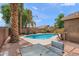 Inviting kidney-shaped pool with patio furniture at 3471 E Powell Way, Gilbert, AZ 85298