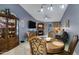 Dining area with round table, six chairs, and a wooden china cabinet at 3510 E Hampton Ave # 3, Mesa, AZ 85204