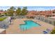 Community pool with surrounding patio furniture and shaded areas at 3510 E Hampton Ave # 3, Mesa, AZ 85204