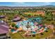 Community pool and recreation area with water slides at 3543 W Magellan Dr, Anthem, AZ 85086