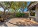 Landscaped backyard with stone pathway and trees at 3543 W Magellan Dr, Anthem, AZ 85086