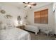 Guest bedroom with twin beds and decorative accents at 3543 W Magellan Dr, Anthem, AZ 85086