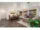 Dining area with a wooden table and adjacent seating area at 3543 W Magellan Dr, Anthem, AZ 85086