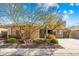 Single-story home with brick accents and a landscaped front yard at 3543 W Magellan Dr, Anthem, AZ 85086