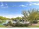 Scenic community lake with waterfall feature and lush landscaping at 3543 W Magellan Dr, Anthem, AZ 85086