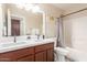 Clean bathroom with double vanity, a bathtub, and updated fixtures at 3640 W Melinda Ln, Glendale, AZ 85308